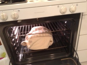 Place pot wrapped in towel into the oven and set the oven timer to 8 hours.